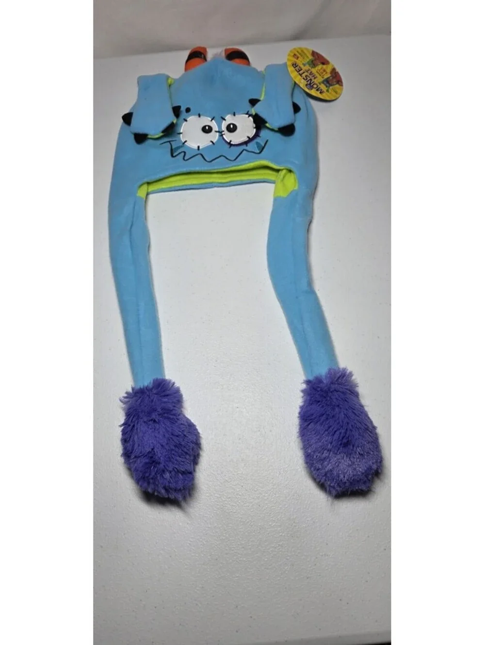 Monster Hat w/Moving Paws Ages 3+ Blue/Green One Size
